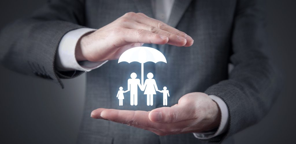 Man protect family symbol with a umbrella. Family insurance concept